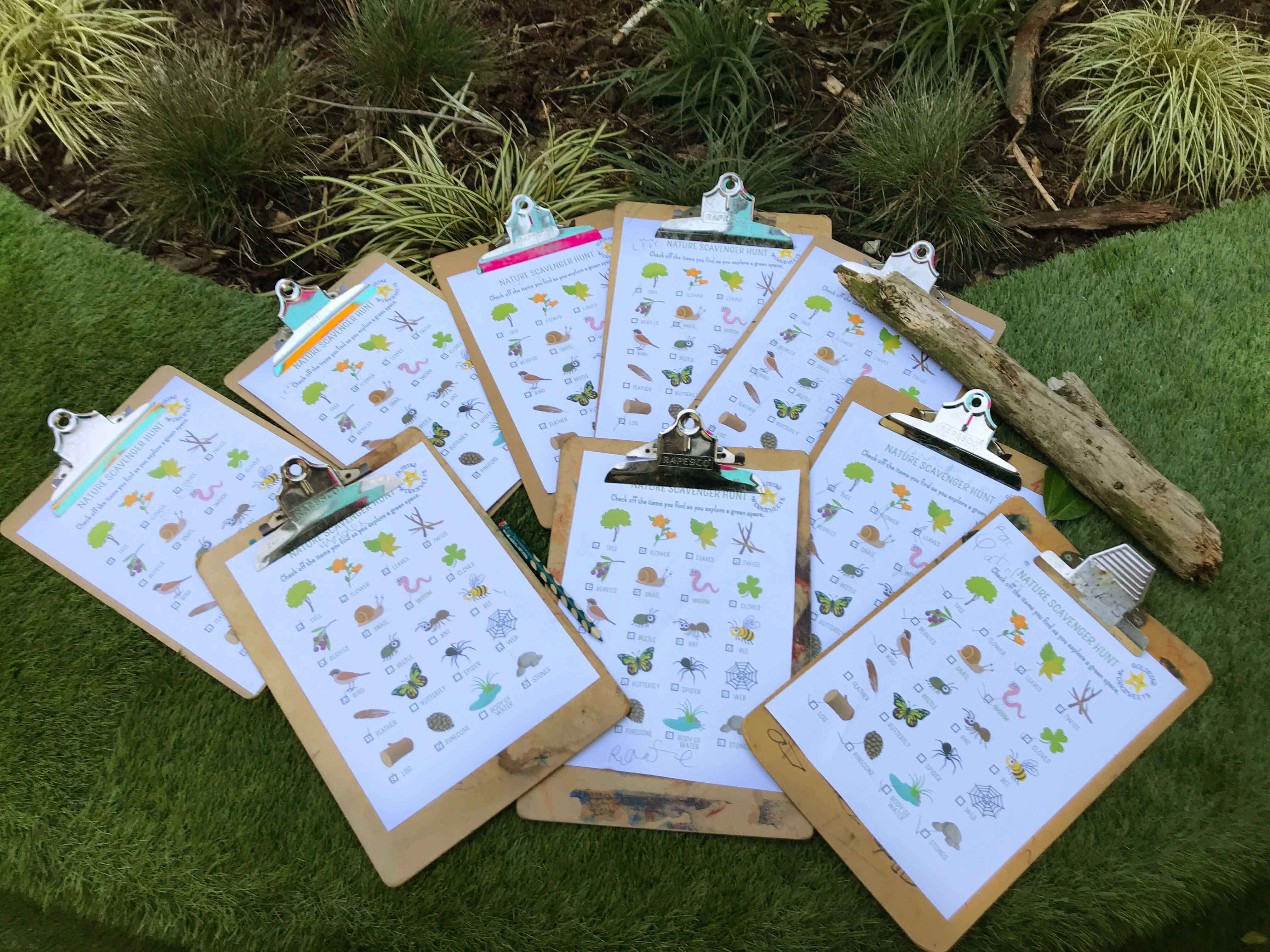 Nature Scavenger Hunt PDF on Clipboards at an Activity Nature Scavenger Hunt PDF on Clipboards at an Activity